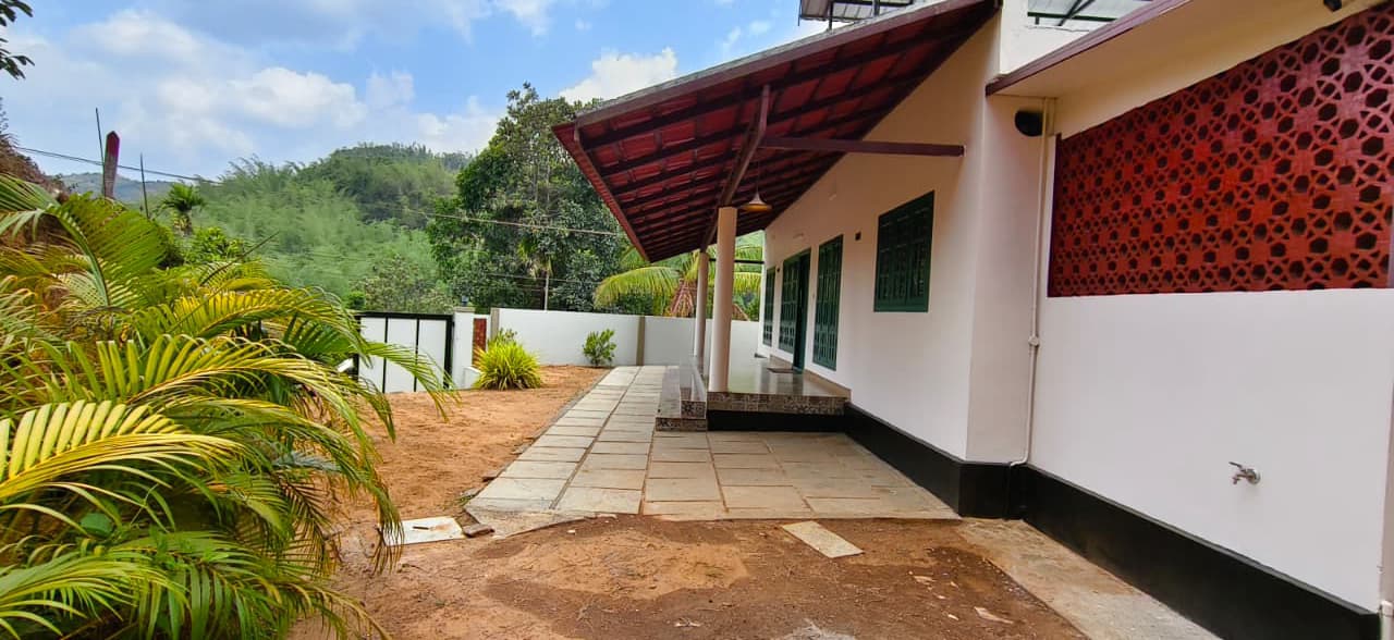 Outdoor pathway and garden boundary alongside the villa