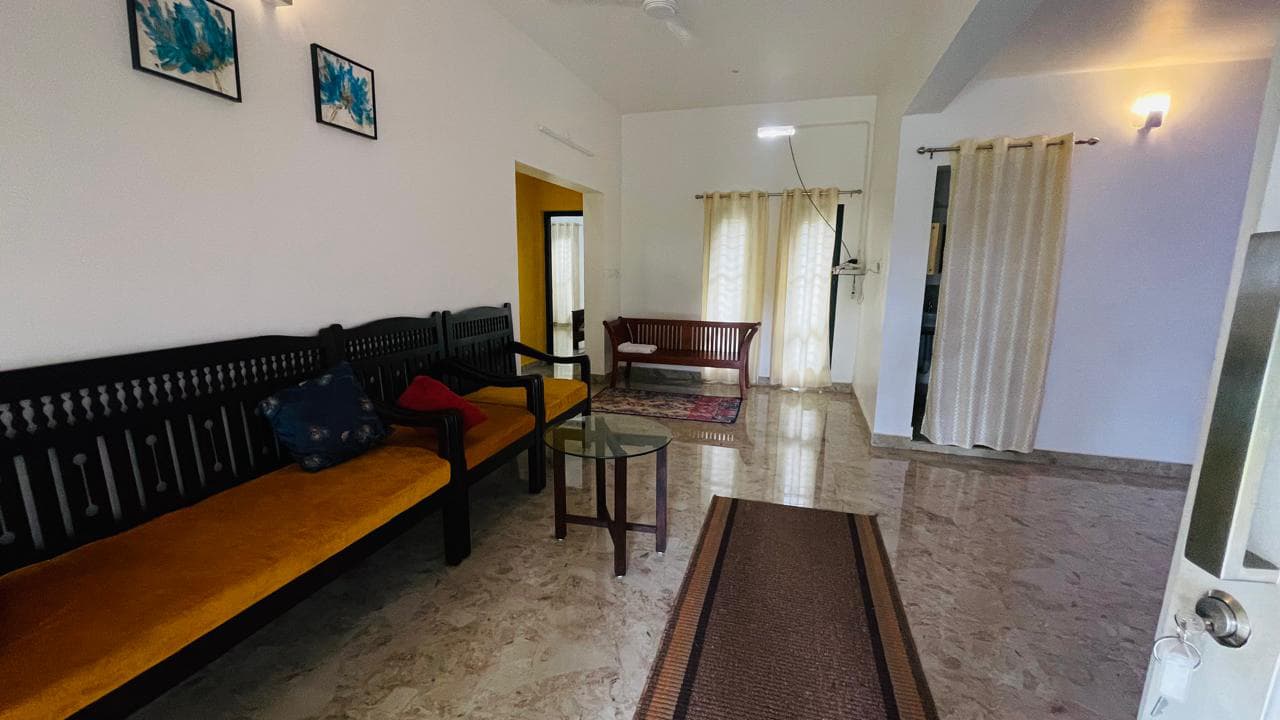 Hallway seating area with comfortable chairs and windows